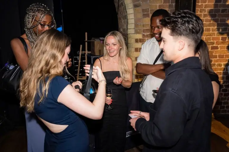 Guests reacting to Charlie Hewish's close-up magic