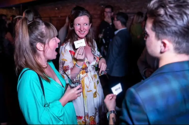 Guests reacting to Charlie Hewish's close-up magic