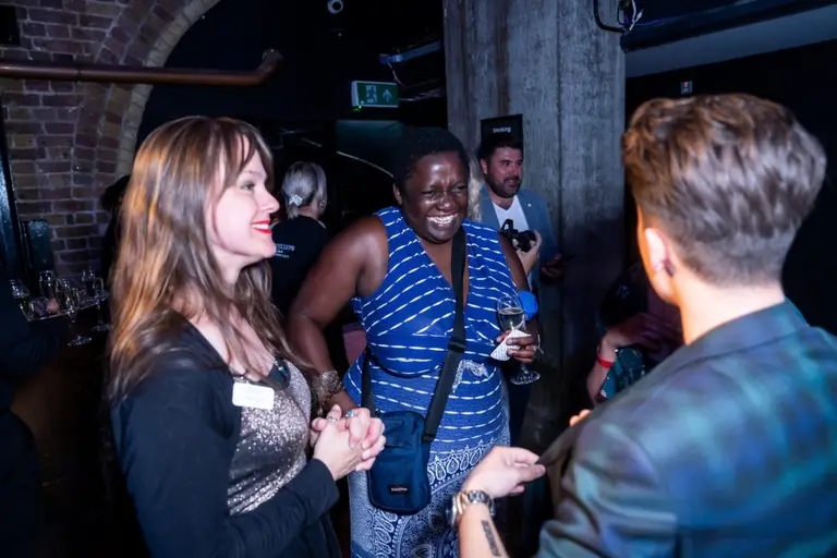 Guests reacting to Charlie Hewish's close-up magic