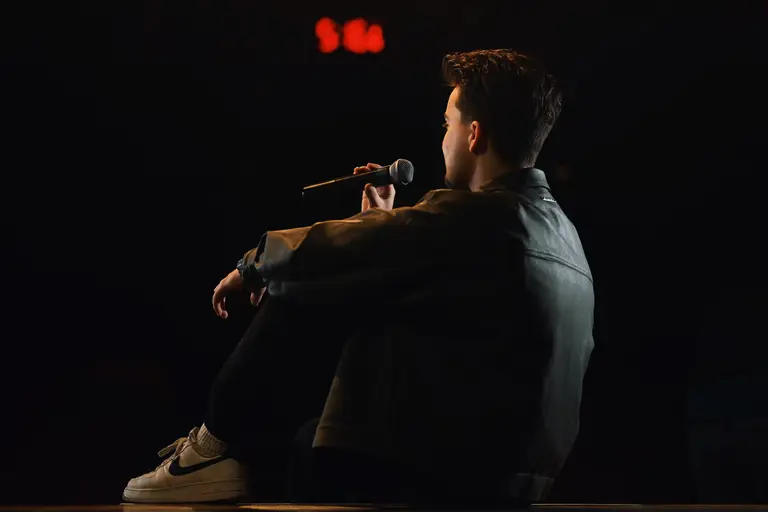 Charlie Hewish performing on stage